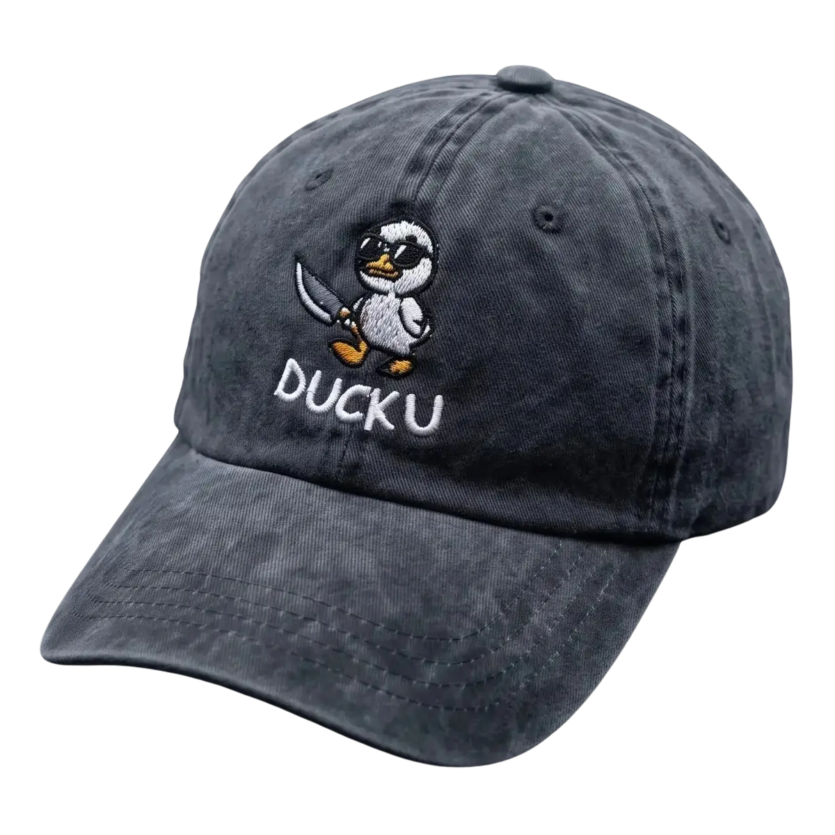 A dark gray washed cotton baseball cap featuring an embroidered cartoon duck character holding a sword and the text 'DUCKU' on the front, displayed on a dark textured surface.